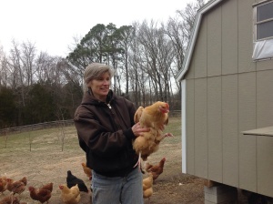 Jan holding one of their prized chickens